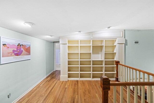 interior space featuring vaulted ceiling and light wood-type flooring