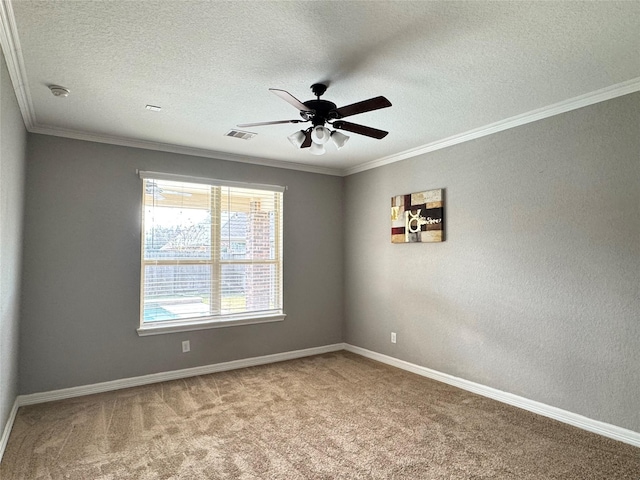 carpeted spare room featuring a textured ceiling, ceiling fan, and ornamental molding