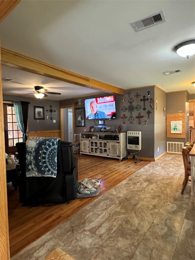 living room with wood-type flooring, ceiling fan, and crown molding