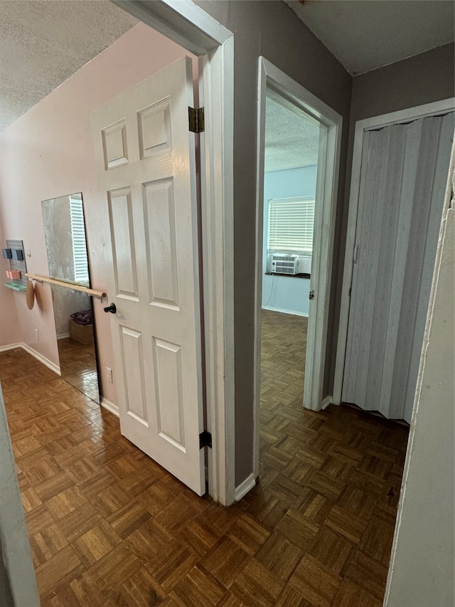 hall featuring cooling unit and dark parquet floors