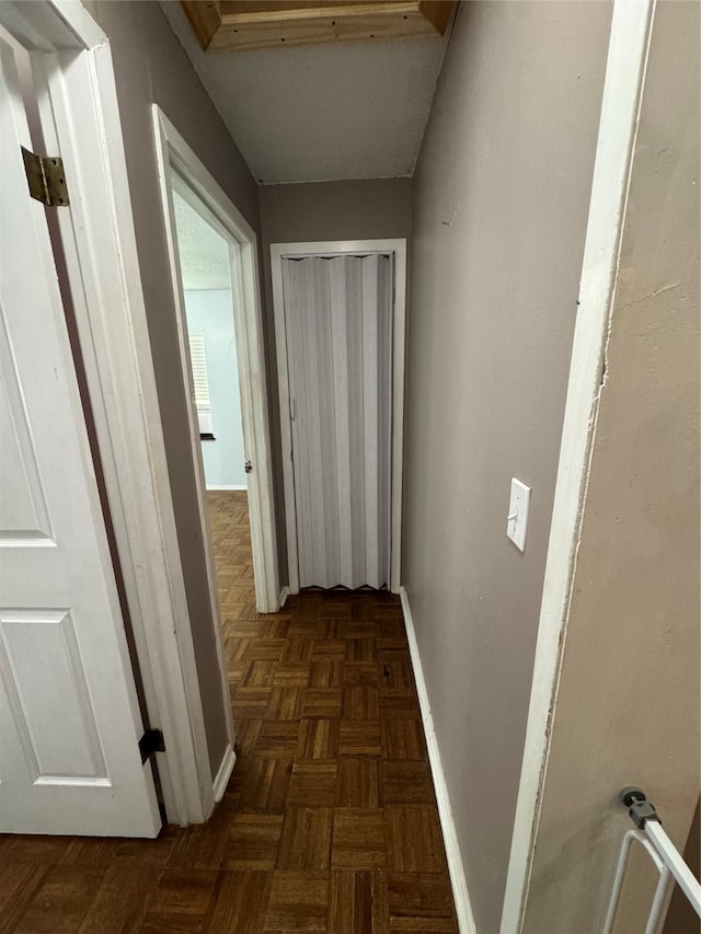 corridor with dark parquet floors