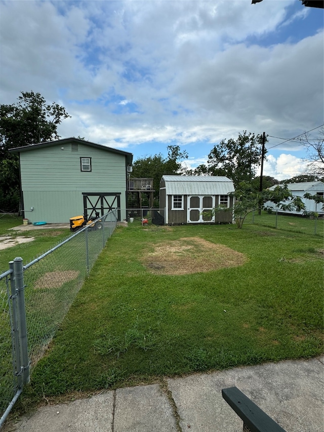 exterior space with a front lawn and an outdoor structure