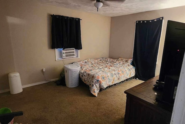 carpeted bedroom with a textured ceiling and ceiling fan