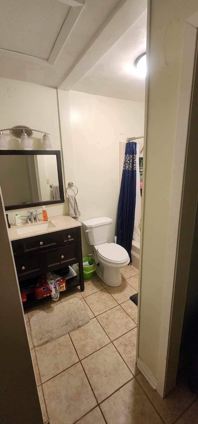 bathroom with tile patterned flooring, toilet, and vanity