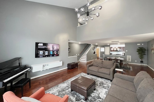 living room featuring wood-type flooring and a notable chandelier