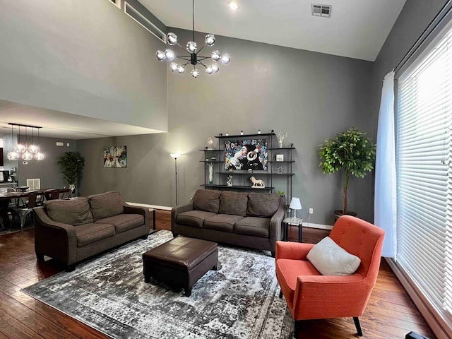 living room featuring a notable chandelier and hardwood / wood-style floors