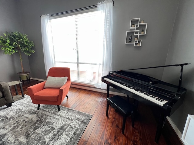 living area with hardwood / wood-style floors