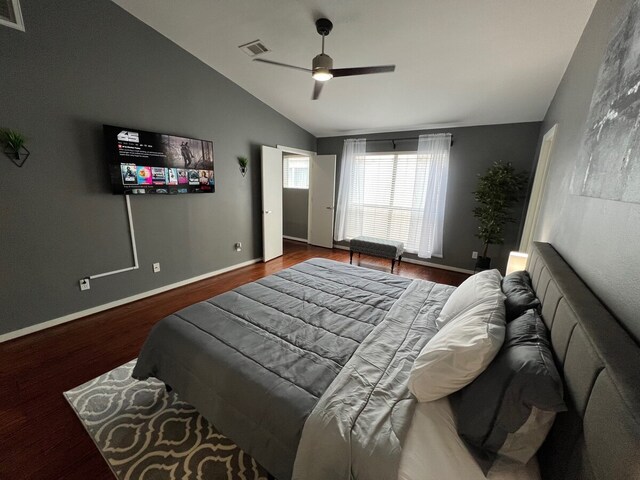 bedroom featuring hardwood / wood-style flooring, vaulted ceiling, and ceiling fan