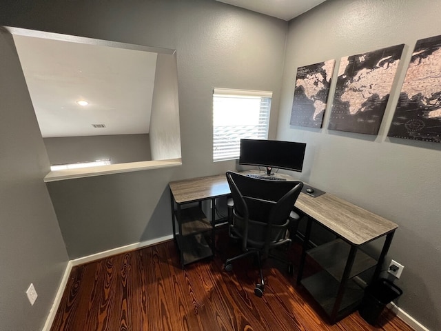 home office with dark wood-type flooring