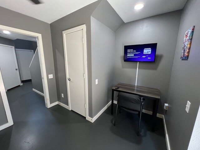 hallway with concrete flooring