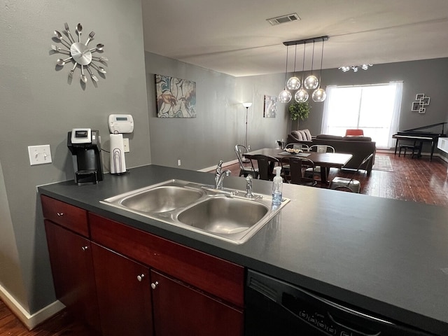 kitchen featuring sink, black dishwasher, dark hardwood / wood-style flooring, and decorative light fixtures