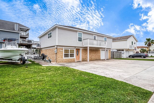 view of front of home with a balcony and a front lawn