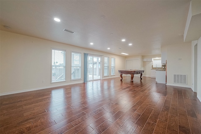 interior space featuring sink, hardwood / wood-style flooring, and billiards