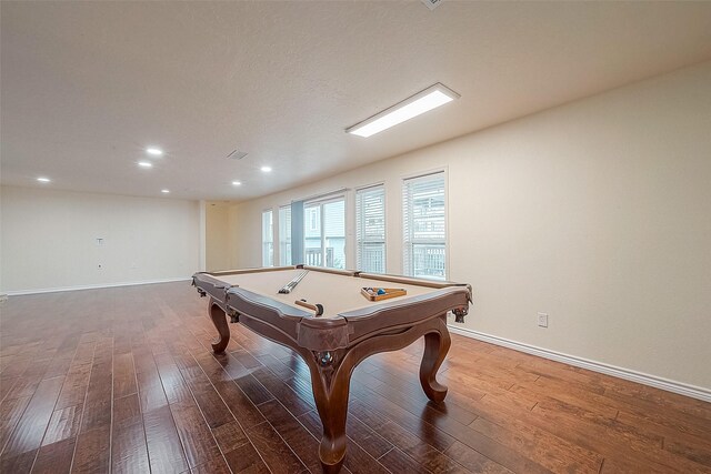 game room with dark hardwood / wood-style floors and billiards