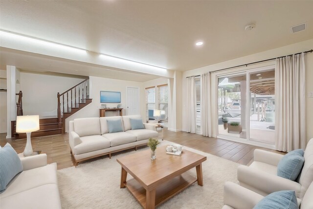 living room with light hardwood / wood-style floors