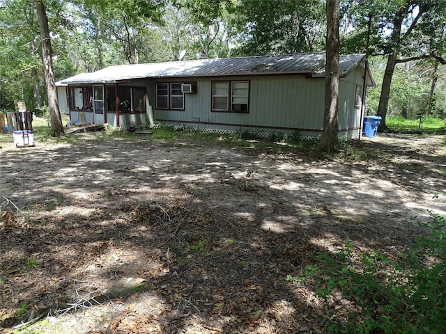 view of front of home with a sunroom