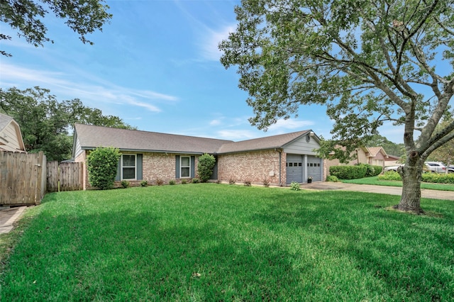 single story home featuring a garage and a front yard