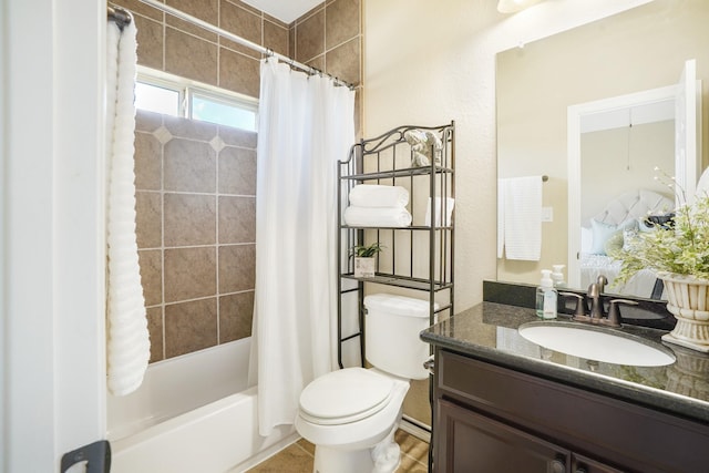 full bathroom with toilet, vanity, and shower / bath combo