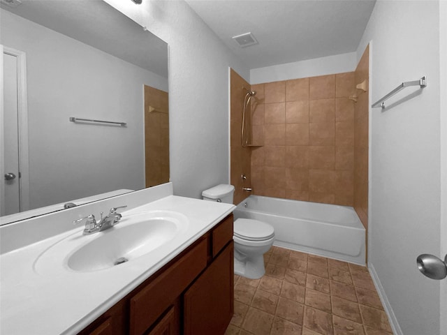 full bathroom featuring vanity, toilet, and tiled shower / bath combo