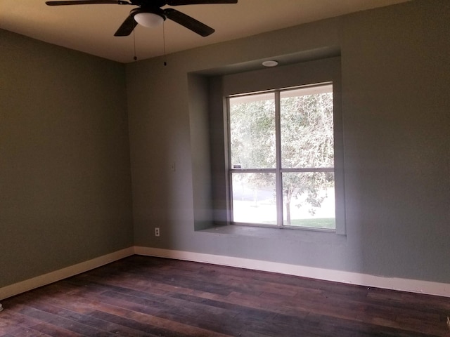 unfurnished room featuring dark hardwood / wood-style floors and ceiling fan