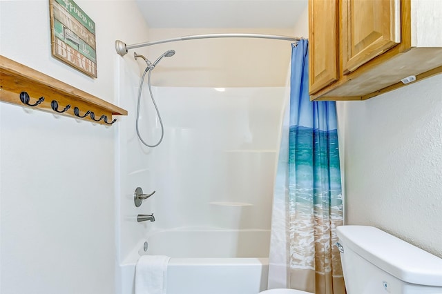 bathroom with toilet and shower / bath combination with curtain