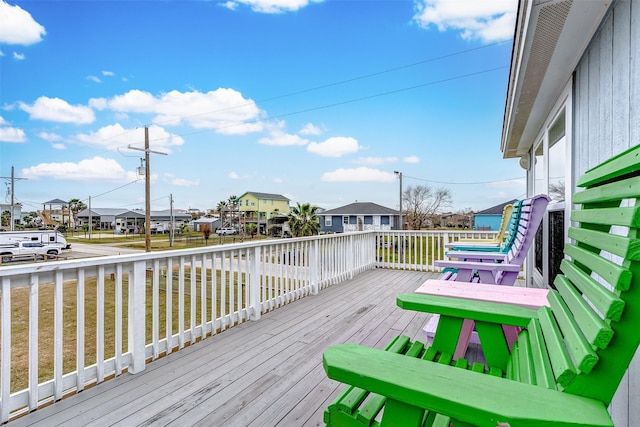 wooden terrace featuring a residential view