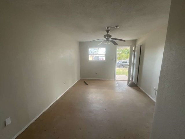 unfurnished room with ceiling fan