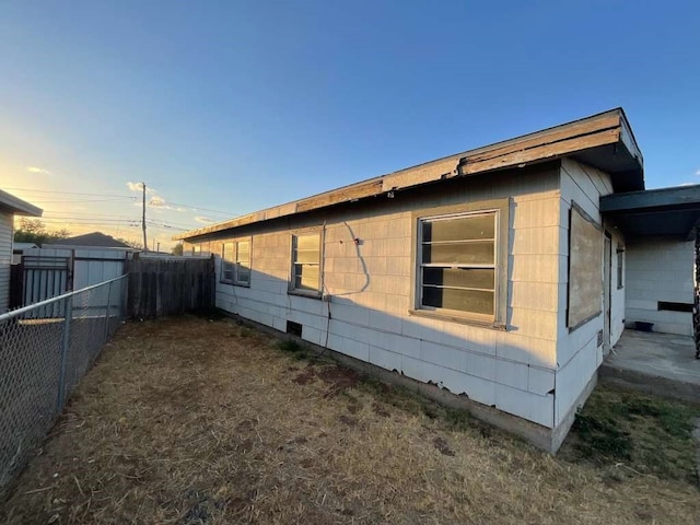 view of property exterior at dusk