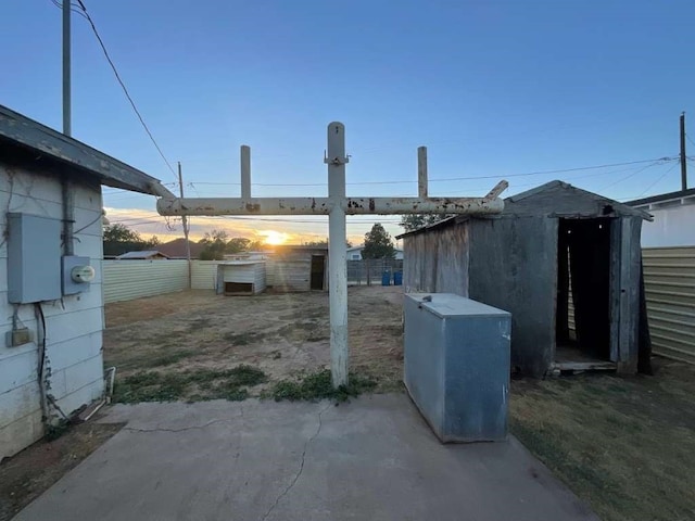 view of patio terrace at dusk