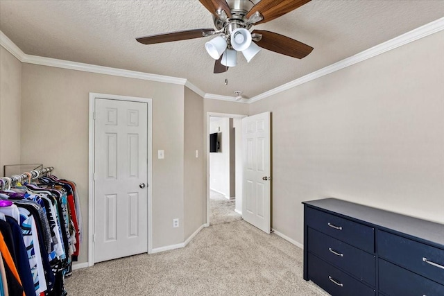 bedroom featuring baseboards, ornamental molding, a textured ceiling, and light colored carpet