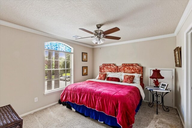 carpeted bedroom with ornamental molding, a textured ceiling, and ceiling fan