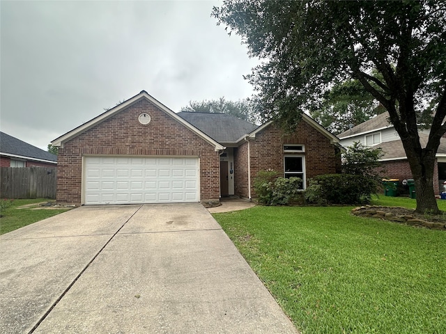 view of front facade with a front lawn and a garage