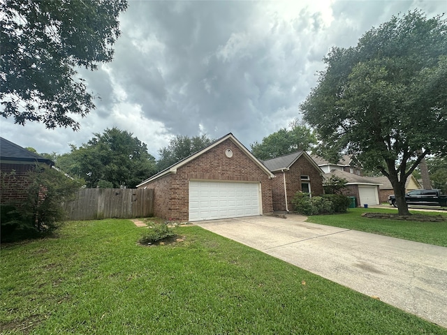 view of front facade with a front lawn and a garage