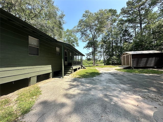 exterior space with a shed