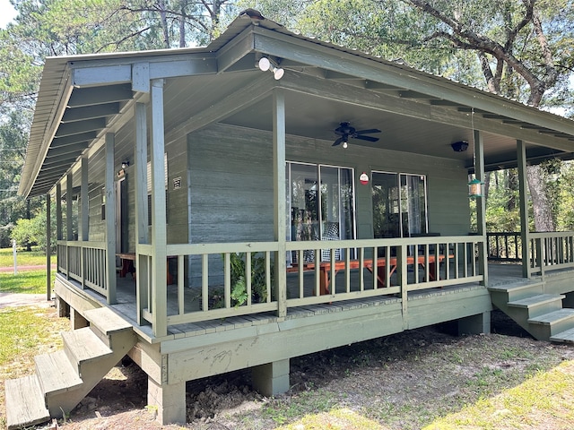 exterior space featuring ceiling fan