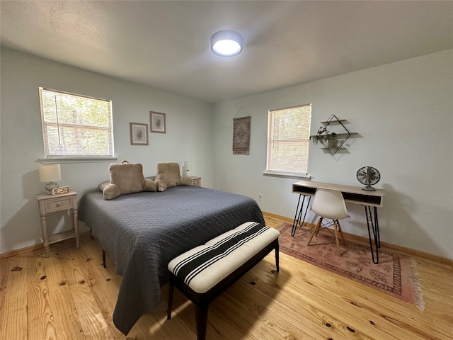 bedroom with light wood-type flooring