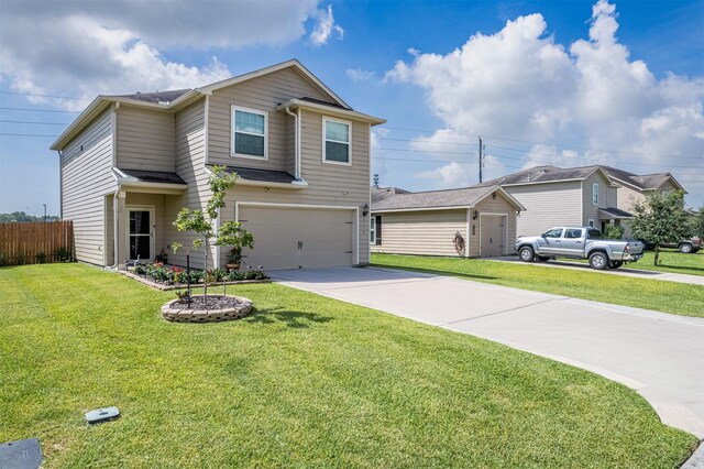 view of front property featuring a garage and a front lawn