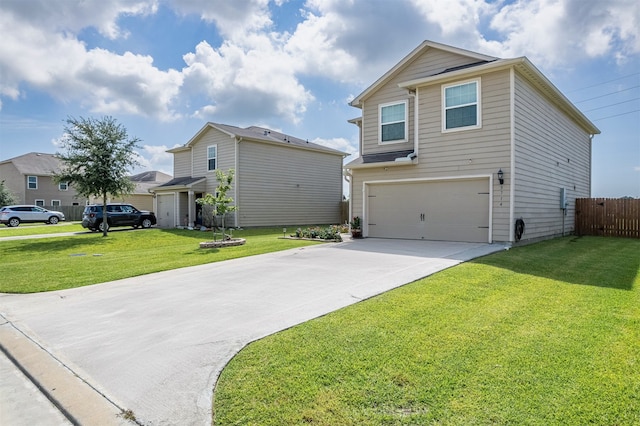 view of property featuring a garage and a front yard