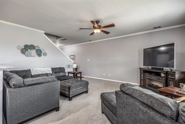 carpeted living room featuring ceiling fan and crown molding