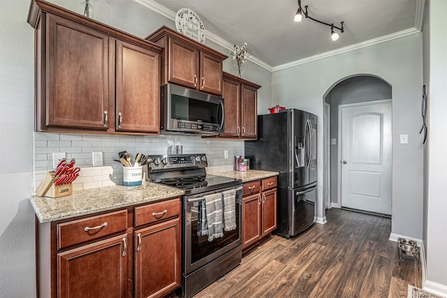 kitchen featuring track lighting, ornamental molding, electric range oven, backsplash, and dark wood-type flooring