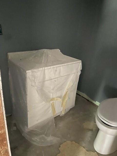 interior space featuring baseboards and concrete floors