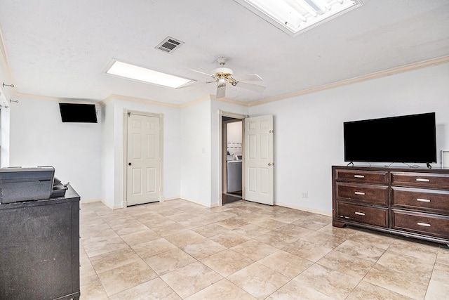 interior space featuring ornamental molding, light tile patterned flooring, washer / dryer, and ceiling fan