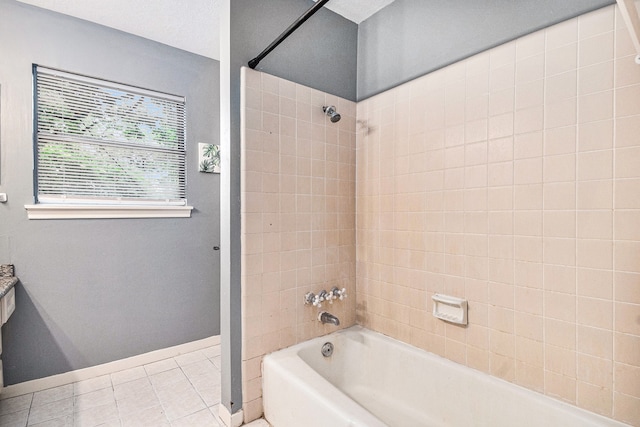 bathroom with tile patterned floors and tiled shower / bath combo