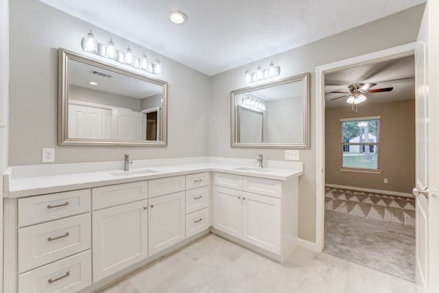 bathroom with double vanity, tile patterned flooring, and ceiling fan