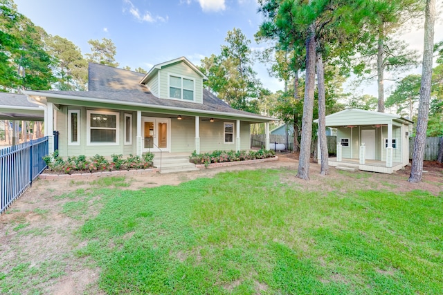 view of front facade with a front yard and covered porch