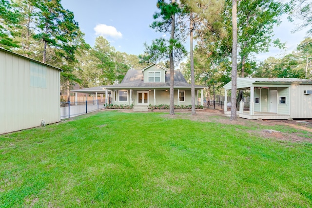 back of house featuring a porch and a lawn