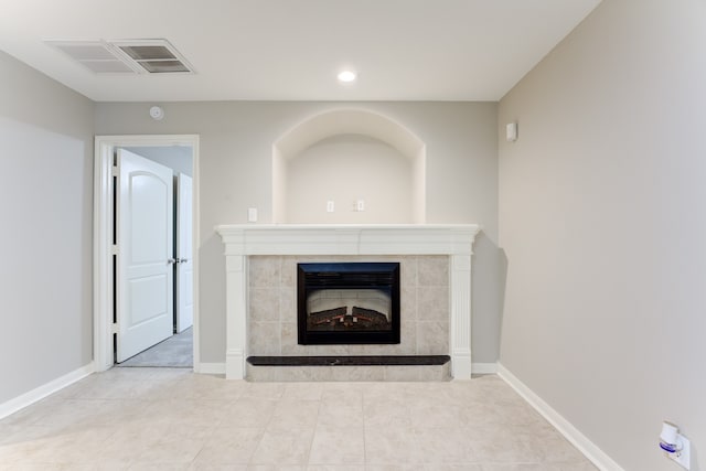 details featuring tile patterned floors and a tile fireplace