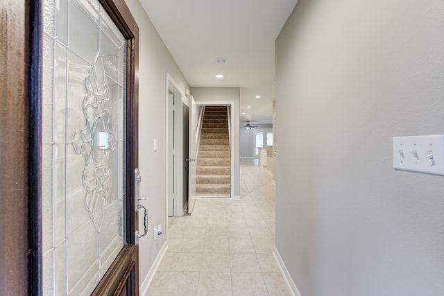 corridor with light tile patterned flooring