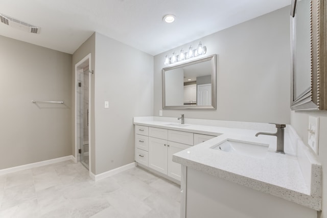 bathroom with vanity, walk in shower, and tile patterned floors