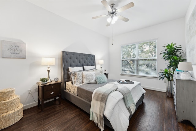 bedroom with dark hardwood / wood-style flooring and ceiling fan